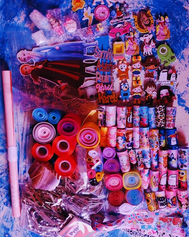 Two table top glass jars of succulents.