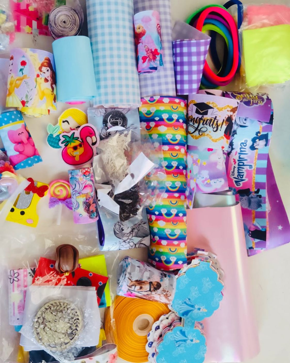 Assorted succulent plants in a glass jar.